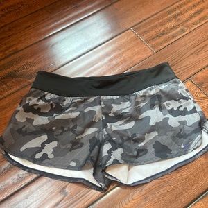 Nike camouflage running shorts, size M, 2.5 inch inseam.